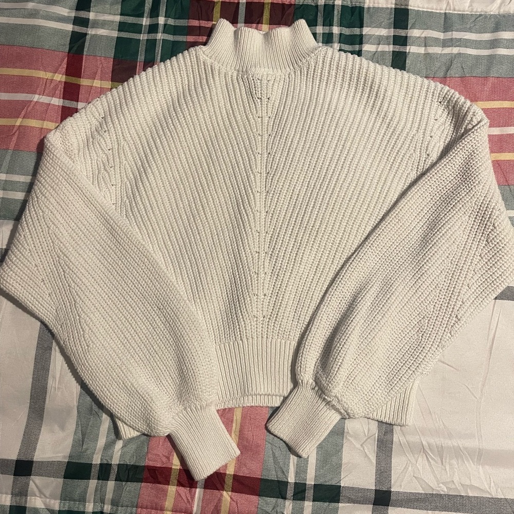Cream colored crop turtleneck cable knit sweater
